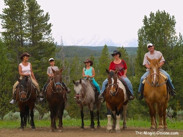 photo of family horseback riding in the Grand Tetons