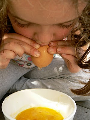 blowing the egg out of the egg shell