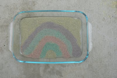 Painting a rainbow with colored sand