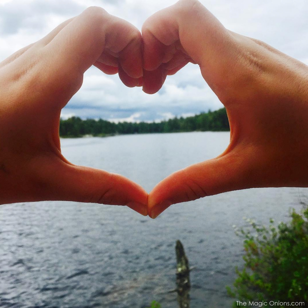 Photo of the lake and hand heart